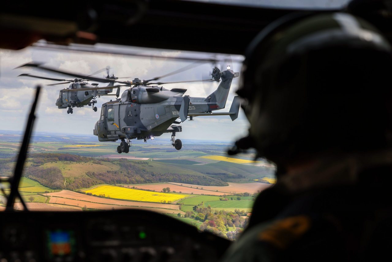 Two Dutch Naval Lynx helicopters viewed from the cockpit of a Royal Navy Merlin